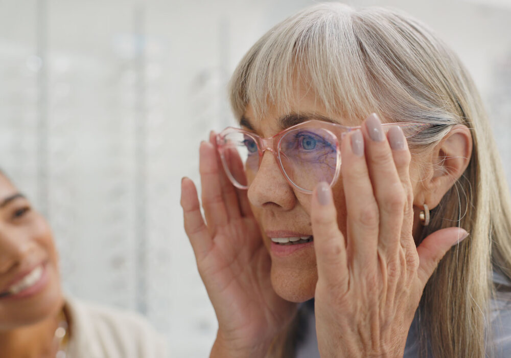 Happy woman, glasses and optician in store for choice, decision Happy woman, glasses and optician in store for choice, decision or customer service. Eye care docto.