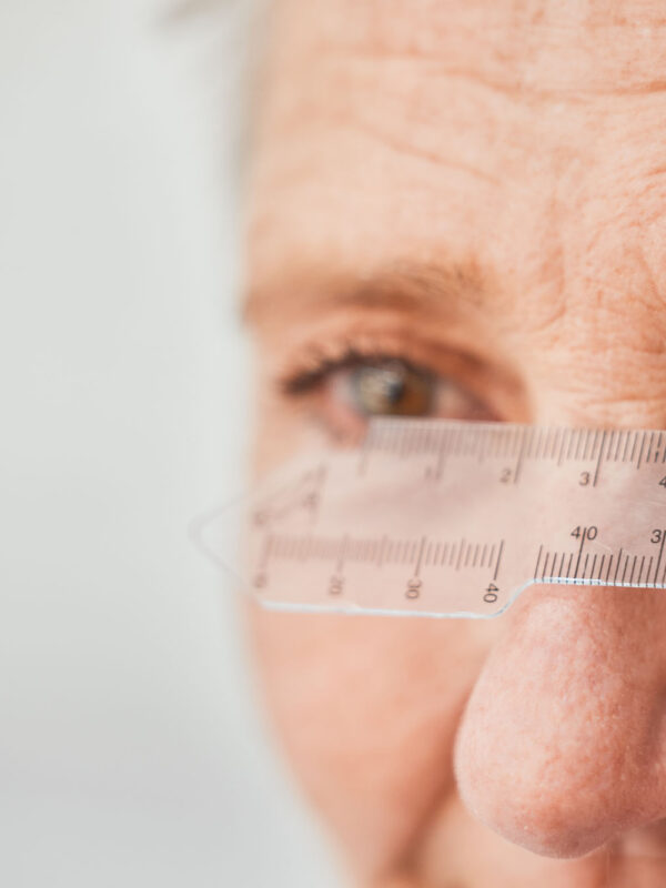 Ophthalmology, ruler and measuring with eyes of old woman for he Ophthalmology, ruler and measuring with eyes of old woman for healthcare, medical and vision. Medic.