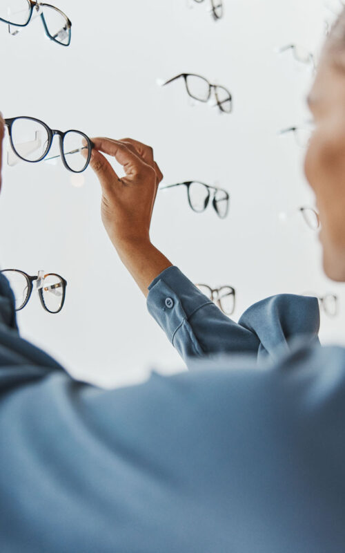 Optometry, eye care and female choosing frame for her prescripti Optometry, eye care and female choosing frame for her prescription lenses at optical store. Healthc.