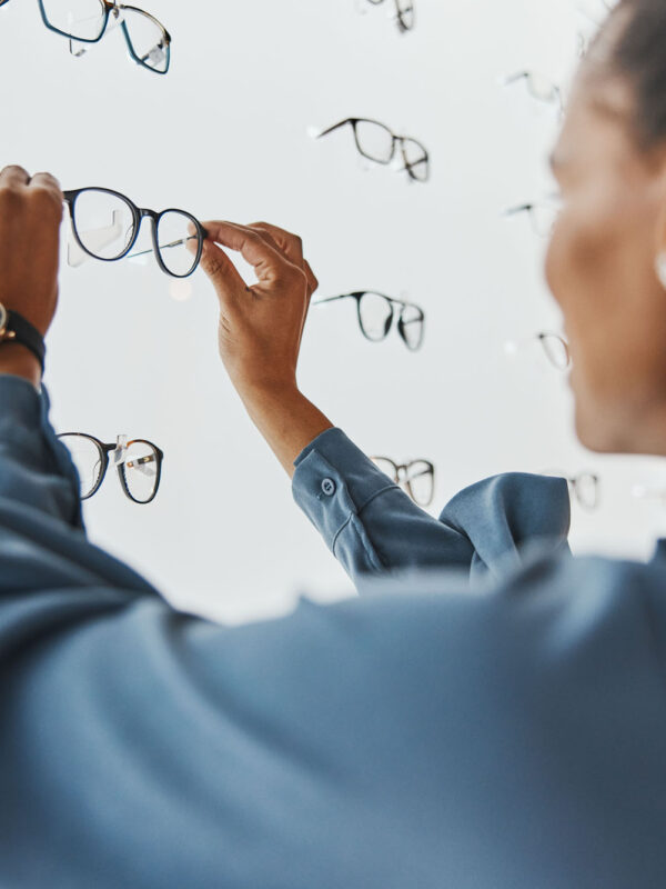Optometry, eye care and female choosing frame for her prescripti Optometry, eye care and female choosing frame for her prescription lenses at optical store. Healthc.